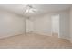 Bright bedroom with carpet flooring, ceiling fan and closet in neutral color palette at 22905 N 19Th Way, Phoenix, AZ 85024