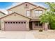 Inviting two-story residence boasting a two-car garage and easy-care desert yard at 22905 N 19Th Way, Phoenix, AZ 85024