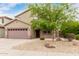 Well-manicured two-story home with a two-car garage and xeriscaped front yard at 22905 N 19Th Way, Phoenix, AZ 85024