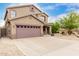 Charming two-story home with a two-car garage and a well-maintained desert landscape at 22905 N 19Th Way, Phoenix, AZ 85024