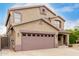 Inviting two-story home featuring a two-car garage, neutral stucco, and attractive landscaping at 22905 N 19Th Way, Phoenix, AZ 85024