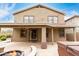 Back exterior with covered patio, hot tub, and fire pit at 22905 N 19Th Way, Phoenix, AZ 85024