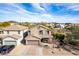 Two story home with a two car garage, desert landscaping and neutral color palette at 22905 N 19Th Way, Phoenix, AZ 85024