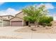 Charming two-story home with a two-car garage and desert landscaping in front yard at 22905 N 19Th Way, Phoenix, AZ 85024