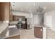Modern kitchen with stainless steel appliances, a kitchen island, and an open floorplan at 22905 N 19Th Way, Phoenix, AZ 85024