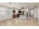 The kitchen has stainless steel appliances, with a neutral backsplash and a modern lighting fixture at 22905 N 19Th Way, Phoenix, AZ 85024