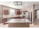 Open kitchen design with island, stainless steel appliances, and ample counter space at 22905 N 19Th Way, Phoenix, AZ 85024