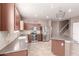 Well-lit kitchen with stainless steel appliances, ample counter space, and stylish tiled backsplash at 22905 N 19Th Way, Phoenix, AZ 85024