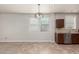 This kitchenette boasts stainless steel appliances, and neutral tiling backsplash at 22905 N 19Th Way, Phoenix, AZ 85024
