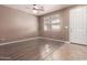 Well-lit room with wood-look floors, bright windows, and a neutral color palette at 22905 N 19Th Way, Phoenix, AZ 85024