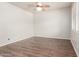 Empty living room with luxury vinyl plank flooring and a ceiling fan at 22905 N 19Th Way, Phoenix, AZ 85024