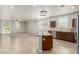 Spacious living room with neutral carpet, abundant natural light, and access to the kitchen at 22905 N 19Th Way, Phoenix, AZ 85024