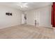 Spacious main bedroom with walk-in closet, en-suite bathroom, and neutral carpeting at 22905 N 19Th Way, Phoenix, AZ 85024