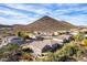 Aerial view of a desert neighborhood near a mountain with clear blue skies at 22905 N 19Th Way, Phoenix, AZ 85024