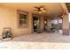 Covered patio with travertine flooring, ceiling fan, dining area, and seamless indoor-outdoor living at 22905 N 19Th Way, Phoenix, AZ 85024