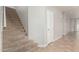 Carpeted staircase leading upstairs with natural light and neutral tones at 22905 N 19Th Way, Phoenix, AZ 85024