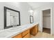 Bright bathroom features dual sinks, a white countertop, and a shower-tub combo at 2472 W Hawks Eye Ave, Apache Junction, AZ 85120