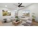 Bright and airy living room with a ceiling fan and neutral decor at 2472 W Hawks Eye Ave, Apache Junction, AZ 85120