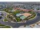 Aerial view of a community featuring a pool, clubhouse, and well-maintained recreational areas at 2550 E Ellsworth Rd # 791, Mesa, AZ 85209