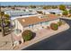 Aerial view of a home shows the layout, landscaping, and proximity to neighborhood amenities at 2550 E Ellsworth Rd # 791, Mesa, AZ 85209