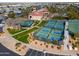 Aerial view of the community tennis and pickleball courts with parking and landscaping at 2550 E Ellsworth Rd # 791, Mesa, AZ 85209