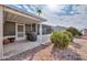 Back patio with grill is surrounded by rock landscaping and lush green foliage in a well-maintained yard at 2550 E Ellsworth Rd # 791, Mesa, AZ 85209