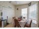 Bright breakfast nook featuring floral wallpaper, a ceiling fan and a window providing natural light at 2550 E Ellsworth Rd # 791, Mesa, AZ 85209