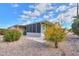 Charming home exterior with gravel landscaping, vibrant flowering bushes, and a well-kept outdoor area at 2550 E Ellsworth Rd # 791, Mesa, AZ 85209