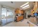 Bright kitchen featuring wood cabinets, a tile floor and sliding doors to an outdoor seating area at 2550 E Ellsworth Rd # 791, Mesa, AZ 85209