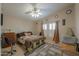 Well-lit main bedroom with a ceiling fan, tiled floors and coordinated decor at 2550 E Ellsworth Rd # 791, Mesa, AZ 85209