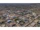 Extensive community aerial view showing the layout of homes, lots and surrounding desert landscape at 2729 W Dolores Rd, Phoenix, AZ 85086