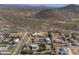 An aerial view of a desert neighborhood, showing the layout of the homes and their surrounding landscape at 2729 W Dolores Rd, Phoenix, AZ 85086