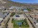 Aerial view showcasing a home with a pool, patio, and desert landscape at 2729 W Dolores Rd, Phoenix, AZ 85086