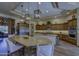 Well-equipped kitchen with a large island and stylish pendant lighting at 2729 W Dolores Rd, Phoenix, AZ 85086