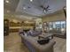 Spacious open-concept living area with plush seating and tile flooring at 2729 W Dolores Rd, Phoenix, AZ 85086