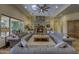 Inviting living room featuring a stone fireplace and comfortable sofas at 2729 W Dolores Rd, Phoenix, AZ 85086