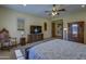 Tranquil main bedroom with plush carpeting, a ceiling fan, and ample storage space at 2729 W Dolores Rd, Phoenix, AZ 85086