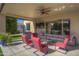 Cozy covered patio with comfortable seating and outdoor entertainment space at 2729 W Dolores Rd, Phoenix, AZ 85086