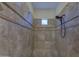 Tiled walk-in shower features a bench seat, multiple showerheads, and decorative tile accents at 2729 W Dolores Rd, Phoenix, AZ 85086