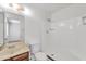 Bathroom features a shower-tub combination, wood-trimmed vanity, and a well-lit mirror at 2815 W Charleston Ave, Phoenix, AZ 85053