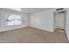 Bright living room with carpeted floors, a large window, and neutral walls at 2815 W Charleston Ave, Phoenix, AZ 85053