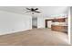 Neutral living space with carpet floors, ample natural light, and a view of the kitchen area at 2815 W Charleston Ave, Phoenix, AZ 85053