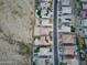 High angle aerial view of a desert community featuring houses with swimming pools and desert landscaping at 30402 W Vale Dr, Buckeye, AZ 85396