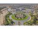 An aerial view showcases the community school near a roundabout at 30402 W Vale Dr, Buckeye, AZ 85396