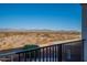 A balcony view reveals a beautiful desert landscape with mountain views in the distance at 30402 W Vale Dr, Buckeye, AZ 85396