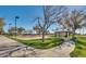 A community park featuring a sand volleyball court, a gazebo and manicured lawns at 30402 W Vale Dr, Buckeye, AZ 85396