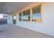 View of the covered patio area featuring a wall with multiple large windows at 30402 W Vale Dr, Buckeye, AZ 85396