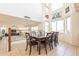 Bright dining area features large windows and a full dining set, open concept living at 30402 W Vale Dr, Buckeye, AZ 85396