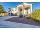 Beautiful front elevation, a three-car garage, desert landscaping, and a grand entrance at 30402 W Vale Dr, Buckeye, AZ 85396