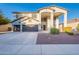 Stunning two-story home featuring a three-car garage, neutral stucco, and manicured front yard at 30402 W Vale Dr, Buckeye, AZ 85396